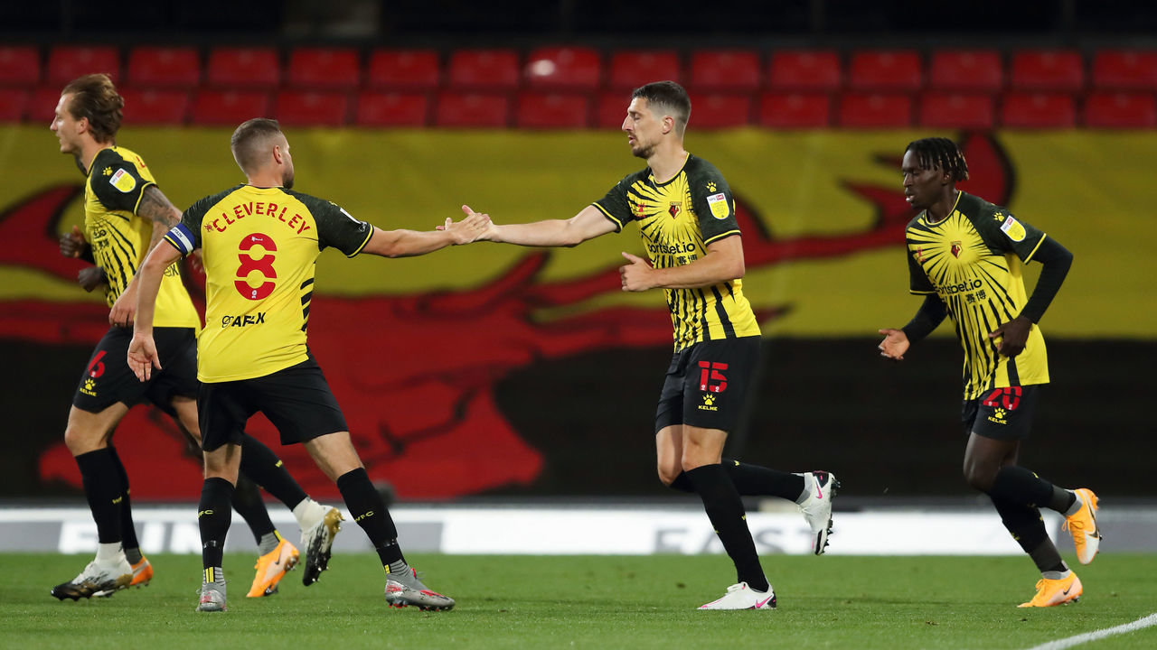 WATFORD, ENGLAND - SEPTEMBER 11: Tom Cleverley congratulates goalscorer Craig Cathcart of Watford after scoring a goal to make it 1-0 during the Sky Bet Championship match between Watford and Middlesbrough at Vicarage Road on September 11, 2020 in Watford, England.