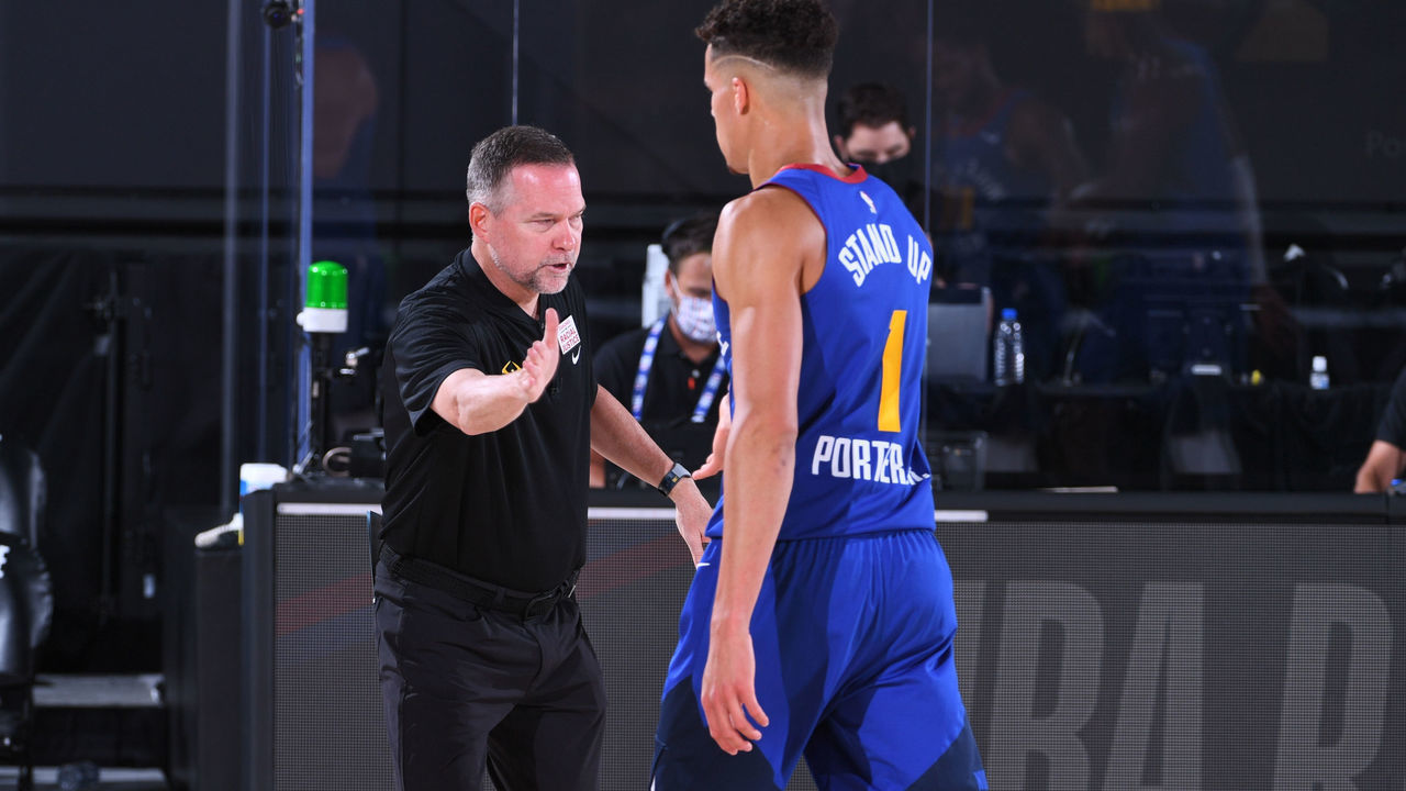 Orlando, FL - AUGUST 8: Head coach Michael Malone and Michael Porter Jr. #1 of the Denver Nuggets hi-five during the game against the Utah Jazz on August 8, 2020 at AdventHealth Arena at ESPN Wide World of Sports in Orlando, Florida. NOTE TO USER: User expressly acknowledges and agrees that, by downloading and/or using this Photograph, user is consenting to the terms and conditions of the Getty Images License Agreement. Mandatory Copyright Notice: Copyright 2020 NBAE