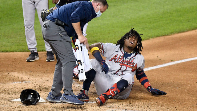 WASHINGTON, DC - SEPTEMBER 11: Ronald Acuna Jr. #13 of the Atlanta Braves reacts after fouling a pitch off his foot in the fourth inning against the Washington Nationals at Nationals Park on September 11, 2020 in Washington, DC. Acuna Jr. would leave the game due to the injury.