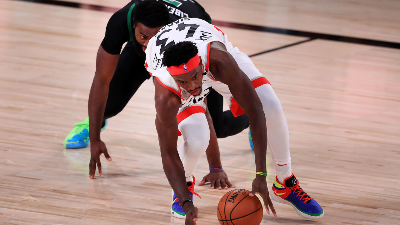 LAKE BUENA VISTA, FLORIDA - SEPTEMBER 11: Pascal Siakam #43 of the Toronto Raptors and Jaylen Brown #7 of the Boston Celtics scramble for a loose ball during the third quarter in Game Seven of the Eastern Conference Second Round during the 2020 NBA Playoffs at AdventHealth Arena at the ESPN Wide World Of Sports Complex on September 11, 2020 in Lake Buena Vista, Florida.