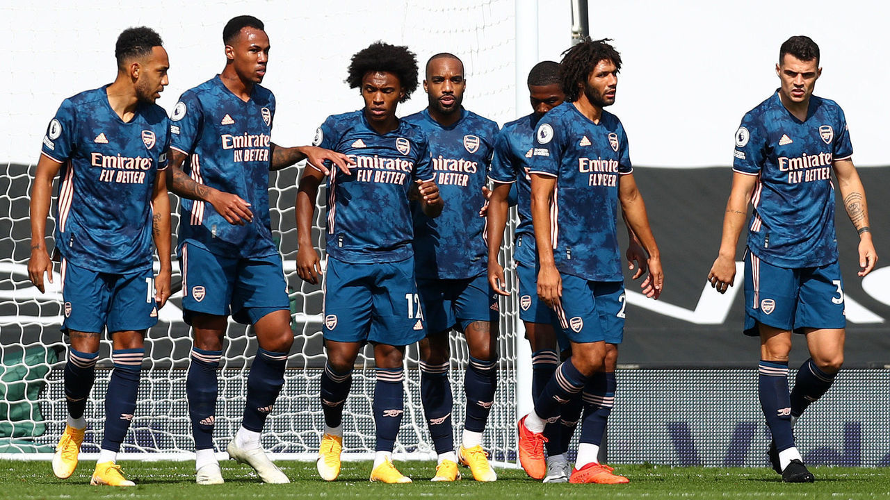 LONDON, ENGLAND - SEPTEMBER 12: Alexandre Lacazette of Arsenal celebrates with his team mates after scoring his team's first goal during the Premier League match between Fulham and Arsenal at Craven Cottage on September 12, 2020 in London, England.