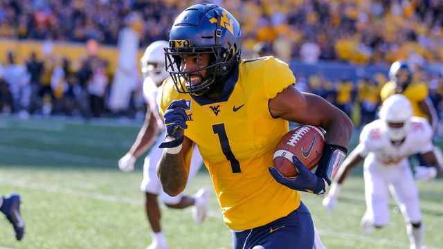 MORGANTOWN, WV - OCTOBER 05: West Virginia Mountaineers wide receiver T.J. Simmons (1) runs after making a catch during the second quarter of the college football game between the Texas Longhorns and the West Virginia Mountaineers on October 5, 2019, at Mountaineer Field at Milan Puskar Stadium in Morgantown, WV.