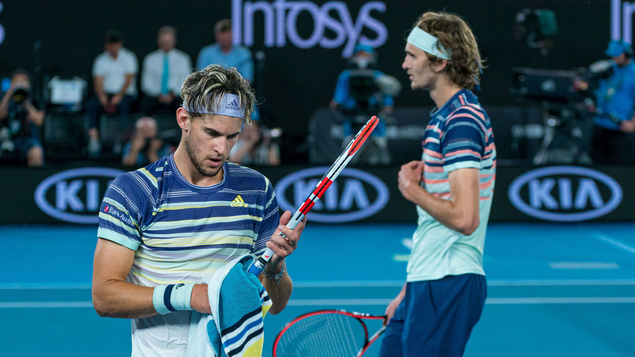 MELBOURNE, AUSTRALIA - JANUARY 31: Dominic Thiem of Austria and Alexander Zverev of Germany change ends during their Men's Singles Semifinal match on day twelve of the 2020 Australian Open at Melbourne Park on January 31, 2020 in Melbourne, Australia.