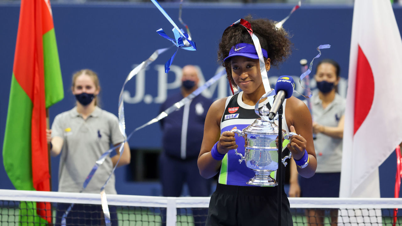 NEW YORK, NEW YORK - SEPTEMBER 12: Naomi Osaka of Japan celebrates with the trophy after winning her Women's Singles final match against Victoria Azarenka of Belarus on Day Thirteen of the 2020 US Open at the USTA Billie Jean King National Tennis Center on September 12, 2020 in the Queens borough of New York City.