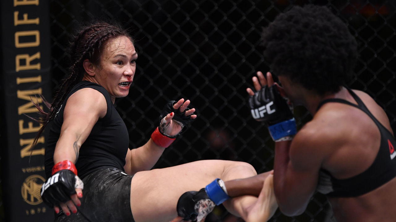 LAS VEGAS, NEVADA - SEPTEMBER 12: (L-R) Michelle Waterson kicks Angela Hill in a strawweight fight during the UFC Fight Night event at UFC APEX on September 12, 2020 in Las Vegas, Nevada.