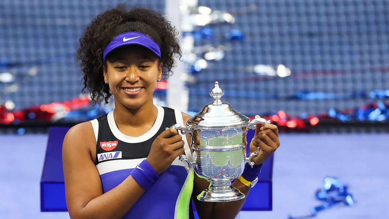 NEW YORK, NEW YORK - SEPTEMBER 12: Naomi Osaka of Japan celebrates with the trophy after winning her Women's Singles final match against Victoria Azarenka of Belarus on Day Thirteen of the 2020 US Open at the USTA Billie Jean King National Tennis Center on September 12, 2020 in the Queens borough of New York City.