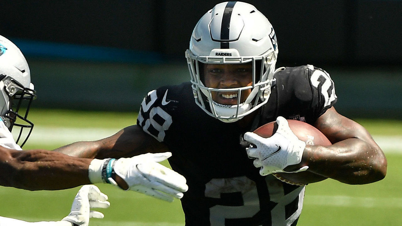 CHARLOTTE, NORTH CAROLINA - SEPTEMBER 13: Jeremy Chinn #21 of the Carolina Panthers pursues Josh Jacobs #28 of the Las Vegas Raiders during the second quarter at Bank of America Stadium on September 13, 2020 in Charlotte, North Carolina.