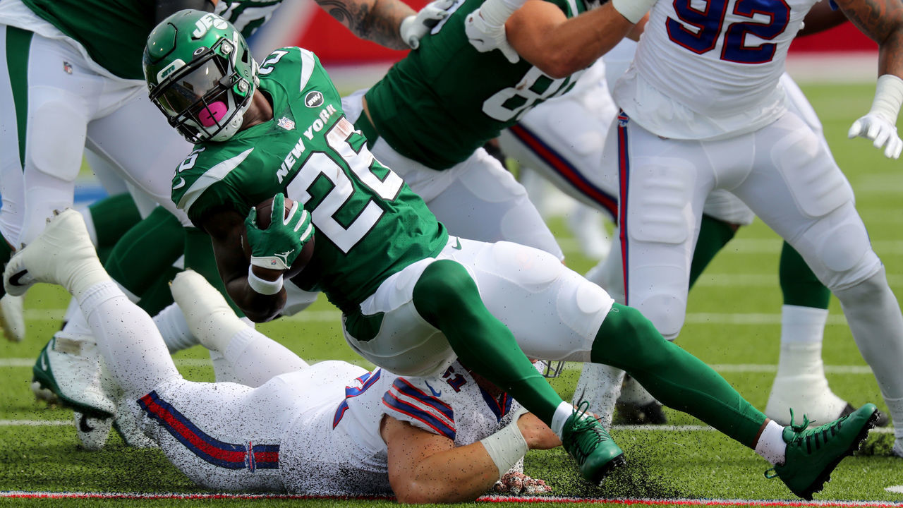 ORCHARD PARK, NY - SEPTEMBER 13: Justin Zimmer #61 of the Buffalo Bills dives to make a tackle on Le'Veon Bell #26 of the New York Jets during the first quarter at Bills Stadium on September 13, 2020 in Orchard Park, New York.
