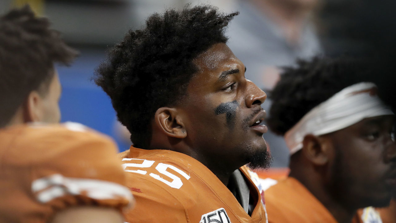 SAN ANTONIO, TX - DECEMBER 31: B.J. Foster #25 of the Texas Longhorns rests on the bench during the Valero Alamo Bowl against the Utah Utes at the Alamodome on December 31, 2019 in San Antonio, Texas.