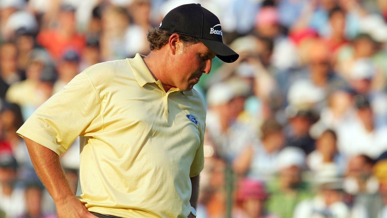 MAMARONECK, NY - JUNE 18: Phil Mickelson reacts after missing his putt for a chance at a playoff on the 18th green during the final round of the 2006 US Open Championship at Winged Foot Golf Club on June 18, 2006 in Mamaroneck, New York. Geoff Ogilvy won the US Open with a one stroke victory.
