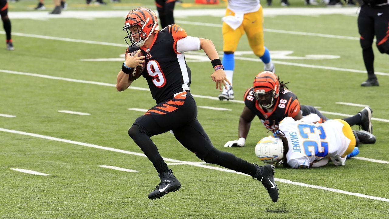 CINCINNATI, OHIO - SEPTEMBER 13: Joe Burrow #9 of the Cincinnati Bengals runs for his first NFL touchdown against the Los Angeles Chargers during the game at Paul Brown Stadium on September 13, 2020 in Cincinnati, Ohio.