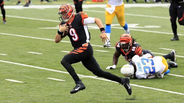 CINCINNATI, OHIO - SEPTEMBER 13: Joe Burrow #9 of the Cincinnati Bengals runs for his first NFL touchdown against the Los Angeles Chargers during the game at Paul Brown Stadium on September 13, 2020 in Cincinnati, Ohio.