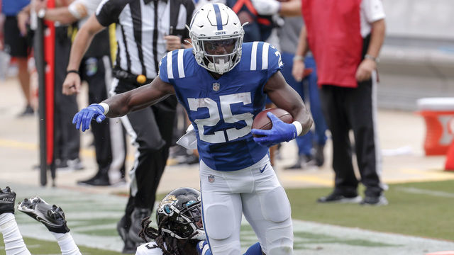JACKSONVILLE, FL - SEPTEMBER 13: Runningback Marlon Mack #25 of the Indianapolis Colts is tackled from behind by Cornerback Tre Herndon #37 of the Jacksonville Jaguars during the game at TIAA Bank Field on September 13, 2020 in Jacksonville, Florida. The Jaguars defeated the Colts 27 to 20.
