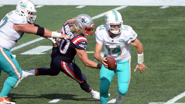 FOXBOROUGH, MASSACHUSETTS - SEPTEMBER 13: Ryan Fitzpatrick #14 of the Miami Dolphins runs with the ball during the second half against the New England Patriots at Gillette Stadium on September 13, 2020 in Foxborough, Massachusetts.
