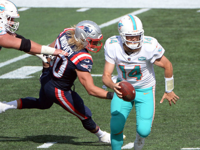 Miami Dolphins quarterback Ryan Fitzpatrick (14) runs the ball