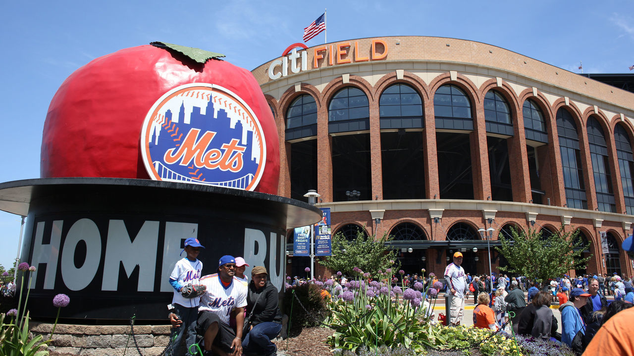 NEW YORK, NEW YORK - May 21: Fans take pictures of themselves in front of the home run apple outside Citi Field, home of the New York Mets before the Los Angeles Angeles Vs New York Mets regular season MLB game at Citi Field on May 21, 2017 in New York City.