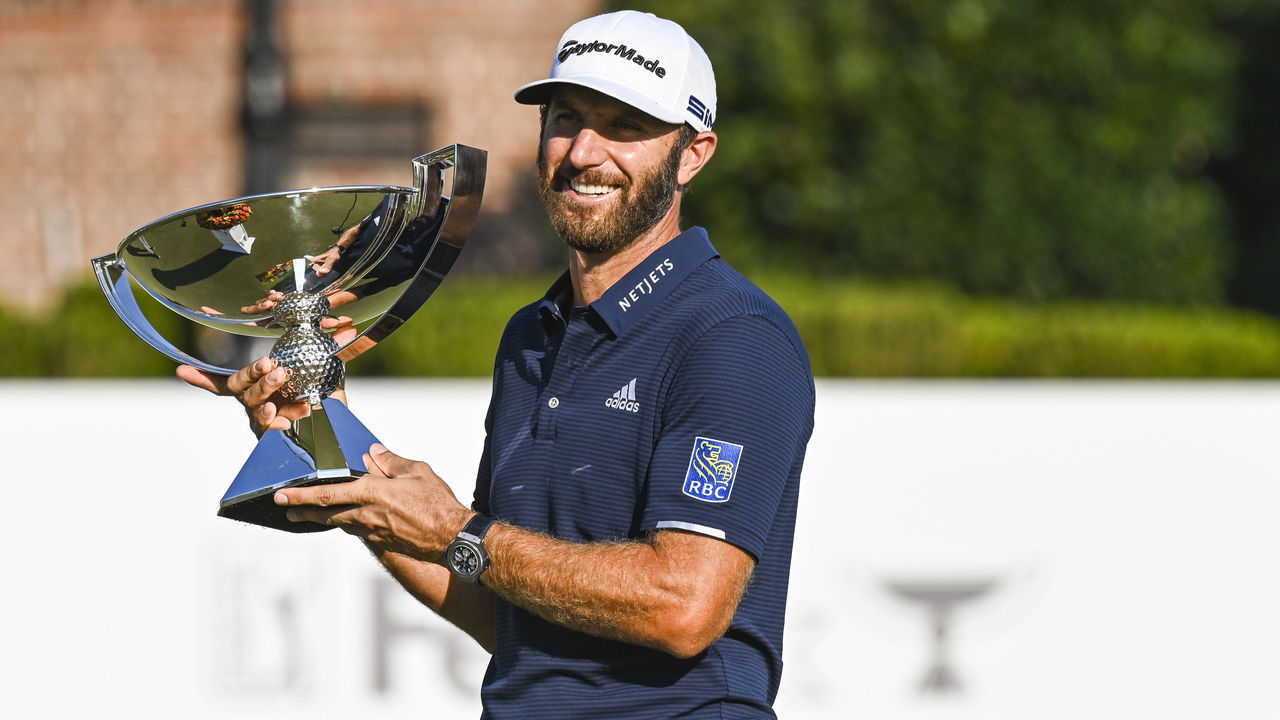 ATLANTA, GA - SEPTEMBER 07: Dustin Johnson smiles with the FedExCup trophy after his three stroke victory during the final round of the TOUR Championship at East Lake Golf Club on September 7, 2020 in Atlanta, Georgia.