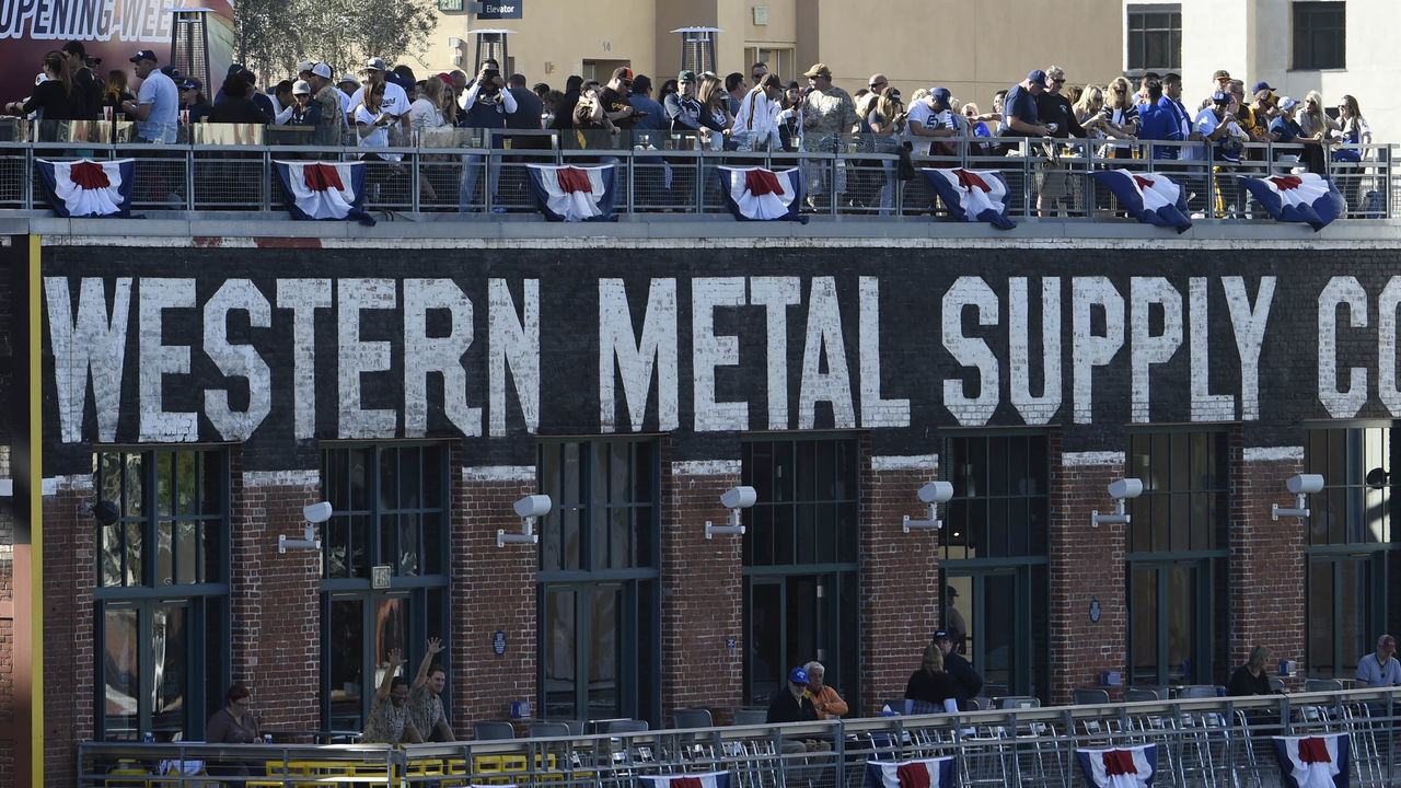 SAN DIEGO, CA - MARCH 30: Fans enjoy the game from atop the Western Metal Supply building on Opening Night before a baseball game between the Los Angeles Dodgers and the San Diego Padres at Petco Park on March 30, 2014 in San Diego, California.