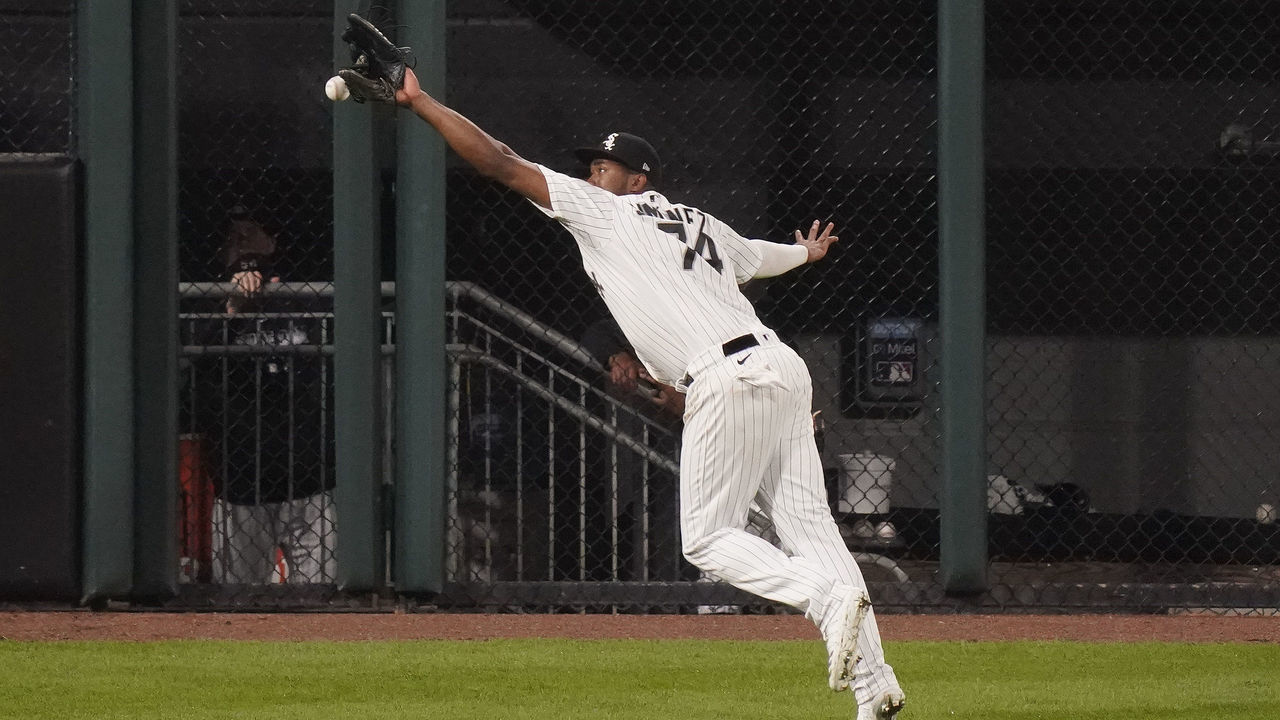 CHICAGO, ILLINOIS - SEPTEMBER 14: Eloy Jimenez #74 of the Chicago White Sox misses the double by Byron Buxton #25 of the Minnesota Twins during the ninth inning of a game at Guaranteed Rate Field on September 14, 2020 in Chicago, Illinois.