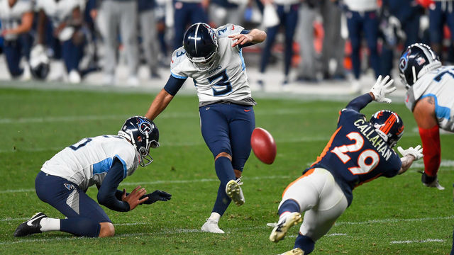 DENVER, CO - SEPTEMBER 14: Stephen Gostkowski #3 of the Tennessee Titans kicks a go-ahead fourth quarter field goal as Brett Kern #6 holds and Bryce Callahan #29 of the Denver Broncos covers the play during a game at Empower Field at Mile High on September 14, 2020 in Denver, Colorado.