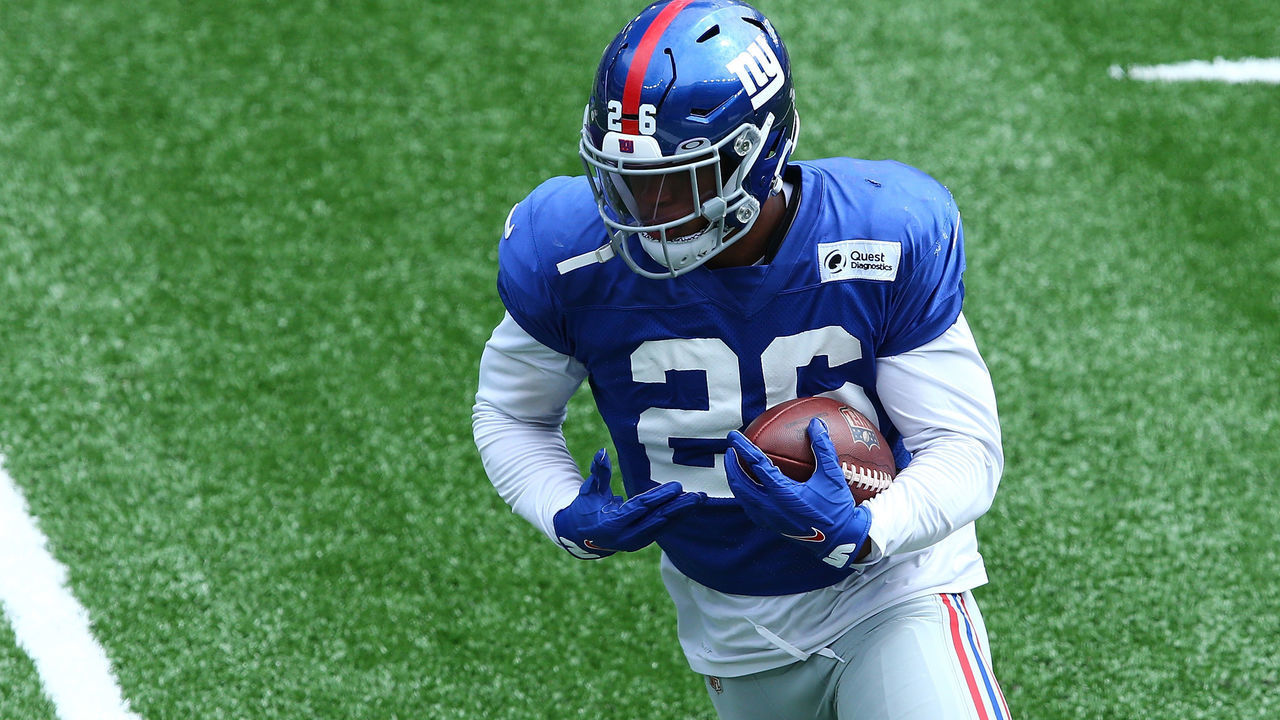 EAST RUTHERFORD, NEW JERSEY - SEPTEMBER 03: Saquon Barkley #26 of the New York Giants runs the ball during the Blue and White scrimmage at MetLife Stadium on September 03, 2020 in East Rutherford, New Jersey.