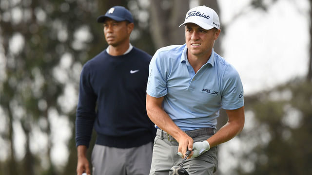 SAN FRANCISCO, CALIFORNIA - AUGUST 07: Tiger Woods of the United States and Justin Thomas of the United States react to his tee shot on the 12th hole during the second round of the 2020 PGA Championship at TPC Harding Park on August 07, 2020 in San Francisco, California.