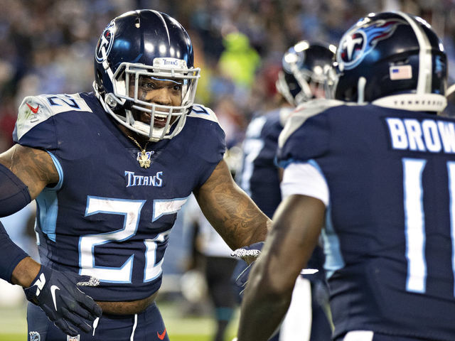 NASHVILLE, TN - NOVEMBER 24: Derrick Henry #22 celebrates after a touchdown by A.J. Brown #11 of the Tennessee Titans during the second half of a game against the Jacksonville Jaguars at Nissan Stadium on November 24, 2019 in Nashville, Tennessee. The Titans defeated the Jaguars 42-20.