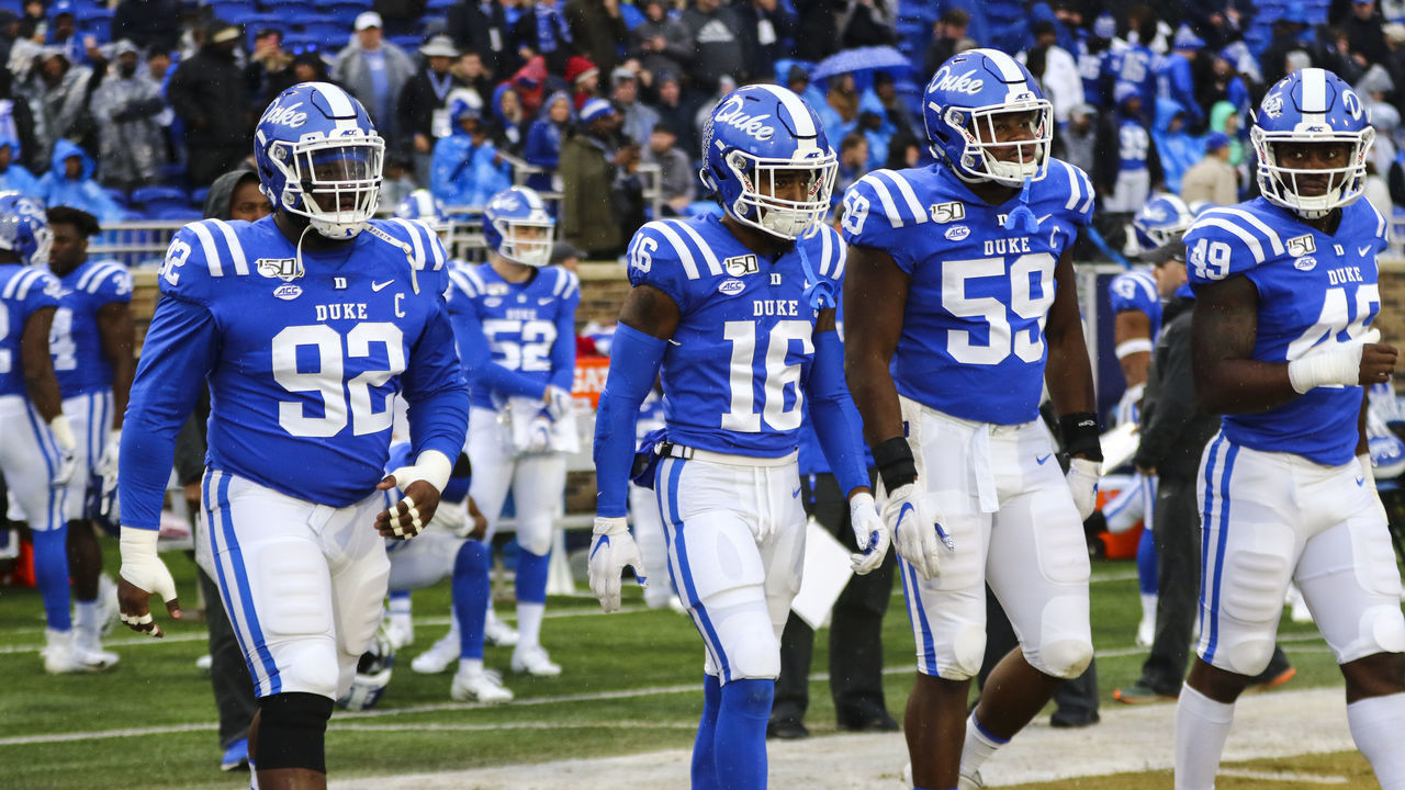 DURHAM, NC - NOVEMBER 30: Duke Blue Devils defensive tackle Edgar Cerenord (92), Duke Blue Devils quarterback Gavin Spurrier (16), Duke Blue Devils defensive end Tre Hornbuckle (59), and Duke Blue Devils linebacker Koby Quansah (49) during the 1st half of the Duke Blue Devils game versus the Miami Hurricanes on November 30th, 2019 at Wallace Wade Stadium in Durham, NC.