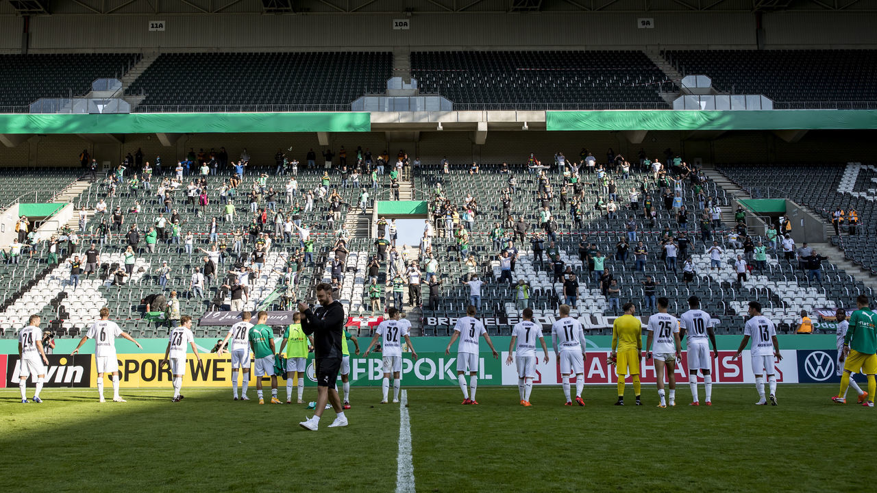 MOENCHENGLADBACH, GERMANY - SEPTEMBER 12: The Team of Borussia Moenchengladbach celebrate with their Fans after the first round DFB Cup match between FC Oberneuland and Borussia Moenchengladbach at Borussia-Park on September 12, 2020 in Moenchengladbach, Germany.