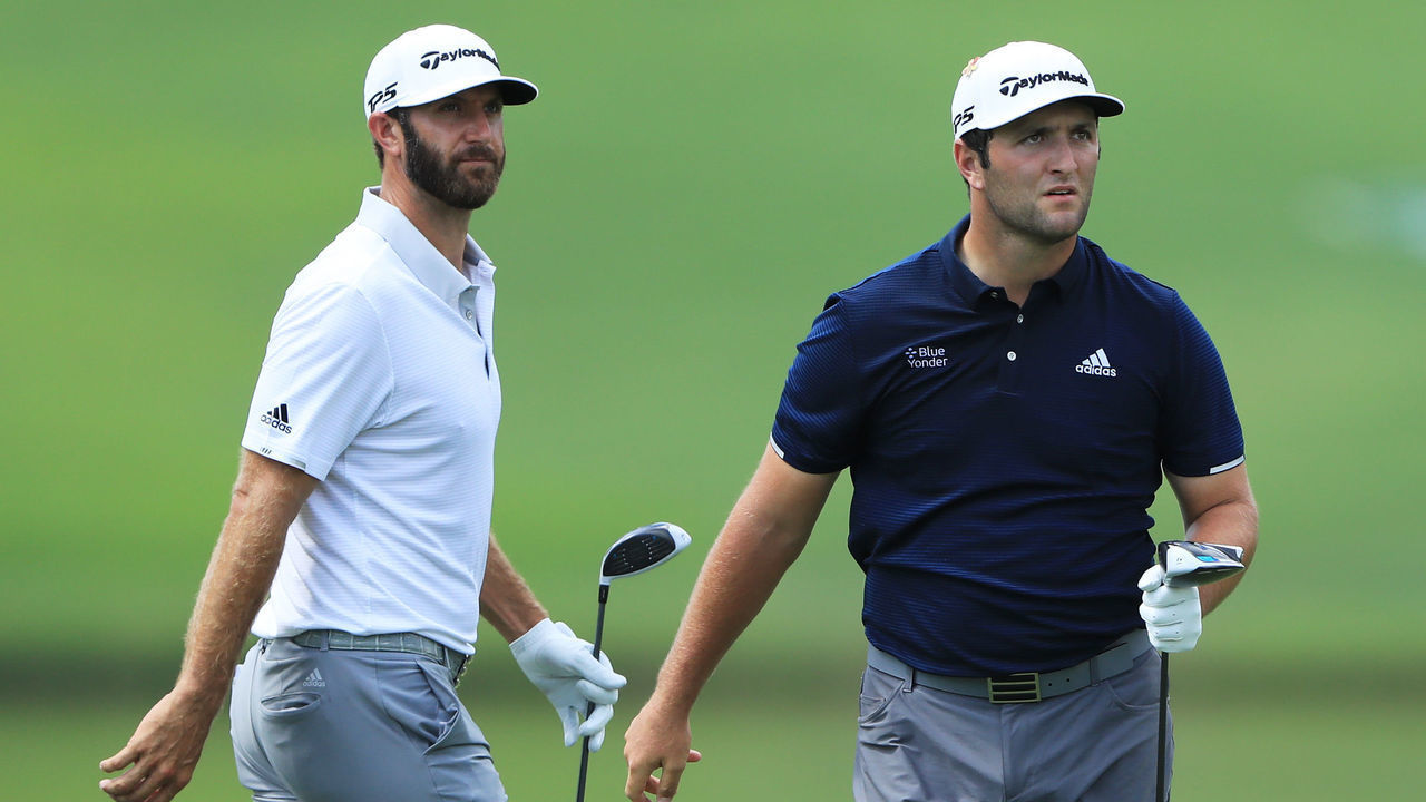ATLANTA, GEORGIA - SEPTEMBER 05: Dustin Johnson of the United States and Jon Rahm of Spain look on from the fourth tee during the second round of the TOUR Championship at East Lake Golf Club on September 05, 2020 in Atlanta, Georgia.