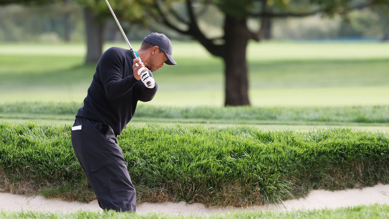 MAMARONECK, NEW YORK - SEPTEMBER 15: Tiger Woods of the United States plays from a bunker during a practice round prior to the 120th U.S. Open Championship on September 15, 2020 at Winged Foot Golf Club in Mamaroneck, New York.