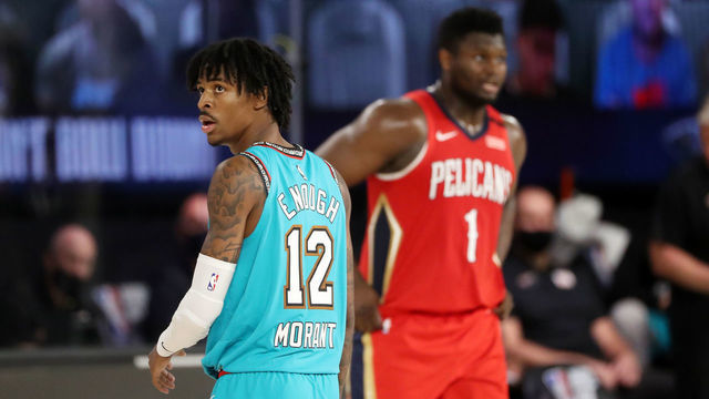 Orlando, FL - AUGUST 3: Ja Morant #12 of the Memphis Grizzlies and Zion Williamson #1 of the New Orleans Pelicans look on during the game on August 3, 2020 at The Visa Athletic Center at ESPN Wide World Of Sports Complex in Reunion, Florida. NOTE TO USER: User expressly acknowledges and agrees that, by downloading and/or using this Photograph, user is consenting to the terms and conditions of the Getty Images License Agreement. Mandatory Copyright Notice: Copyright 2020 NBAE