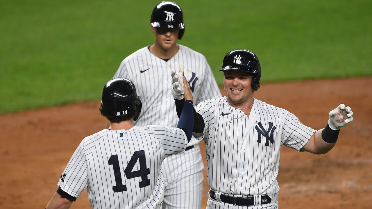 NEW YORK, NEW YORK - SEPTEMBER 15: Luke Voit #59 of the New York Yankees celebrates with Tyler Wade #14 after hitting a three-run home run during the second inning against the Toronto Blue Jays at Yankee Stadium on September 15, 2020 in the Bronx borough of New York City.
