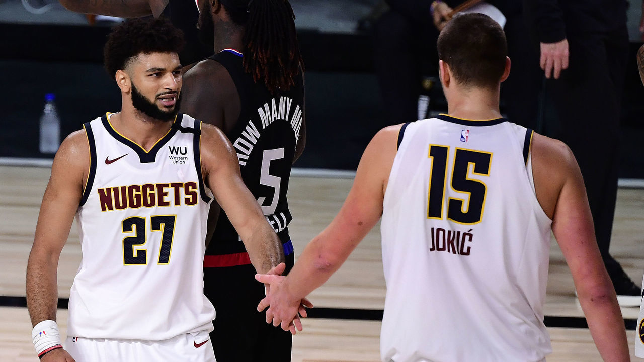 LAKE BUENA VISTA, FLORIDA - SEPTEMBER 15: Jamal Murray #27 of the Denver Nuggets and Nikola Jokic #15 of the Denver Nuggets react during the third quarter against the LA Clippers in Game Seven of the Western Conference Second Round during the 2020 NBA Playoffs at AdventHealth Arena at the ESPN Wide World Of Sports Complex on September 15, 2020 in Lake Buena Vista, Florida.