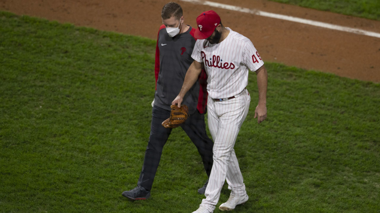 PHILADELPHIA, PA - SEPTEMBER 15: Jake Arrieta #49 of the Philadelphia Phillies walks off the field with trainer Aaron Hoback after sustaining an injury in the top of the sixth inning against the New York Mets at Citizens Bank Park on September 15, 2020 in Philadelphia, Pennsylvania. The Phillies defeated the Mets 4-1.
