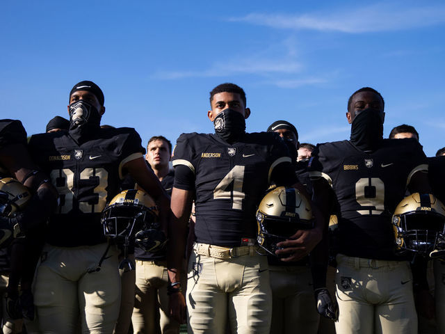 WEST POINT, NY - SEPTEMBER 12: Michael Roberts #14, Reikan Donaldson #83, Christian Anderson #4, Maurice Bellan #9, and Christian Parrish #8 of the Army Black Knights sing the United States Military Academy alma mater after winning a game against the Louisiana Monroe Warhawks at Michie Stadium on September 12, 2020 in West Point, New York.