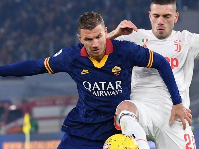 Juventus' Turkish defender Merih Demiral (R) tackles AS Roma's Bosnian forward Edin Dzeko during the Italian Serie A football match AS Roma vs Juventus on January 12, 2020 at the Olympic stadium in Rome.