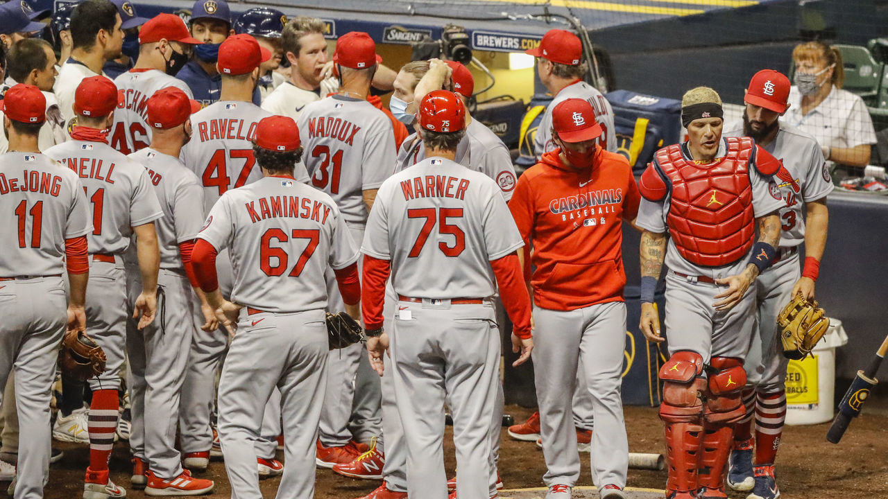 MILWAUKEE, WI - SEPTEMBER 15: St. Louis Cardinals catcher Yadier Molina (4) is escorted away from the Brewer dug out while both managers were ejected from the game during the third game of a five game series between the Milwaukee Brewers and the St. Louis Cardinals on September 15, 2020, at Miller Park in Milwaukee, WI.