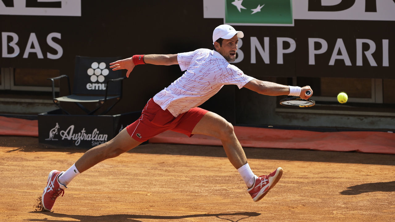 ROME, ITALY - SEPTEMBER 16: Novak Djokovic of Serbia stretches to play a backhand in his round two match against Salvatore Caruso of Italy during day three of the Internazionali BNL d'Italia at Foro Italico on September 16, 2020 in Rome, Italy. (Photo by Riccardo Antimiani -