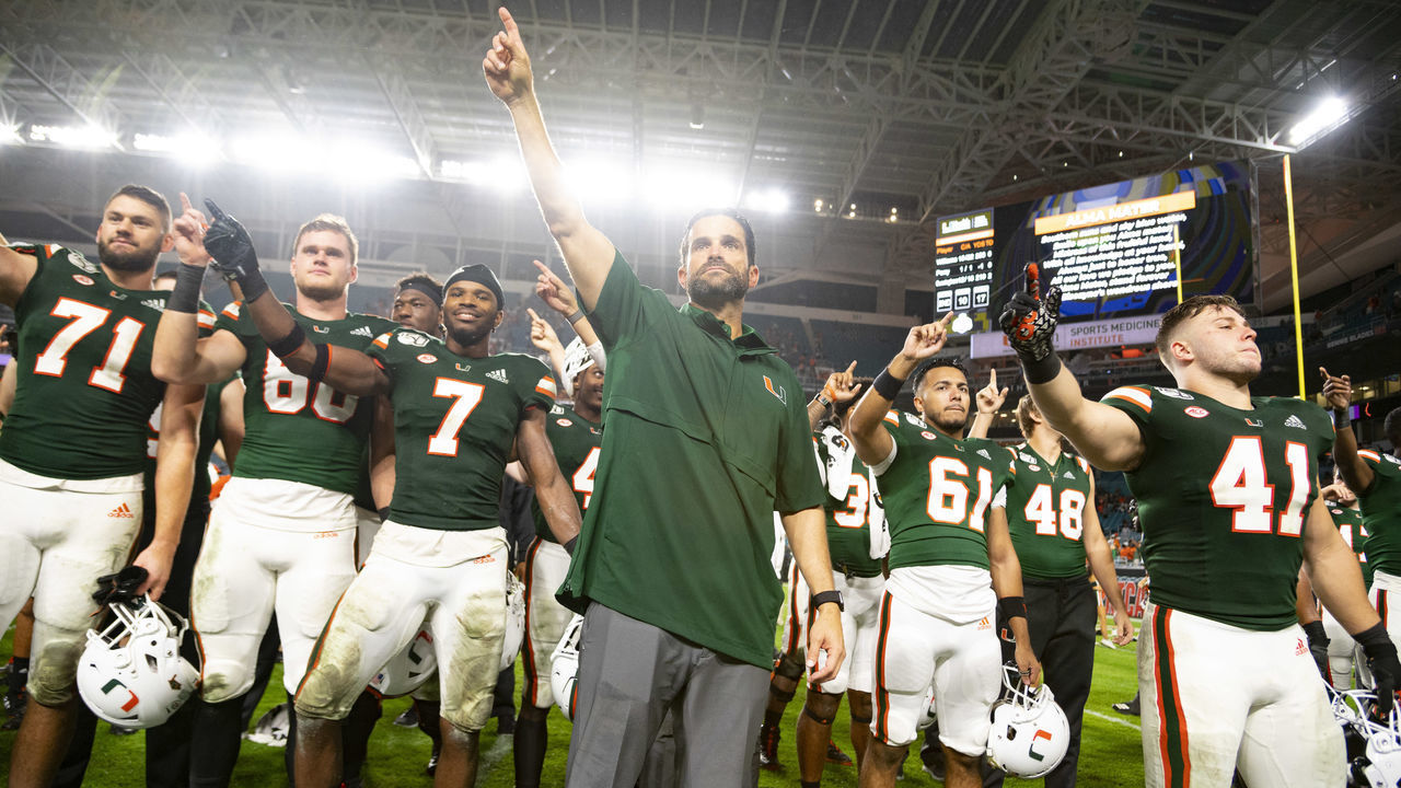 MIAMI GARDENS, FL - NOVEMBER 09: Miami Hurricanes head coach Manny Diaz celebrates with the team after the college football game between the Louisville Cardinals and the University of Miami Hurricanes on November 9, 2019 at the Hard Rock Stadium in Miami Gardens, Florida.