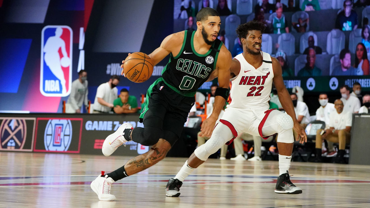 ORLANDO, FL - SEPTEMBER 15: Jayson Tatum #0 of the Boston Celtics handles the ball against Jimmy Butler #22 of the Miami Heat during Game One of the Eastern Conference Finals of the NBA Playoffs on September 15, 2020 at The Field House at ESPN Wide World Of Sports Complex in Orlando, Florida. NOTE TO USER: User expressly acknowledges and agrees that, by downloading and/or using this Photograph, user is consenting to the terms and conditions of the Getty Images License Agreement. Mandatory Copyright Notice: Copyright 2020 NBAE