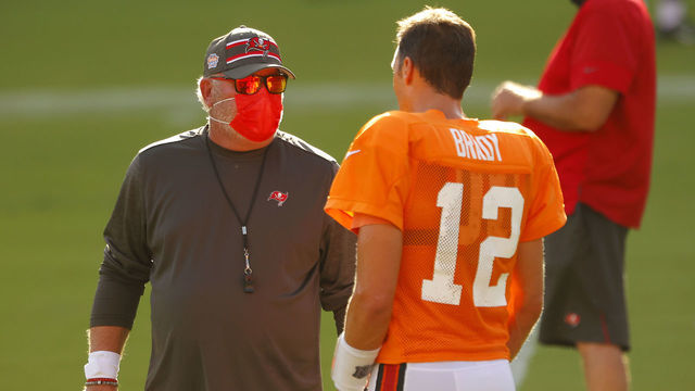 TAMPA, FLORIDA - AUGUST 28: Head coach Bruce Arians of the Tampa Bay Buccaneers talks with Tom Brady #12 during training camp at Raymond James Stadium on August 28, 2020 in Tampa, Florida.