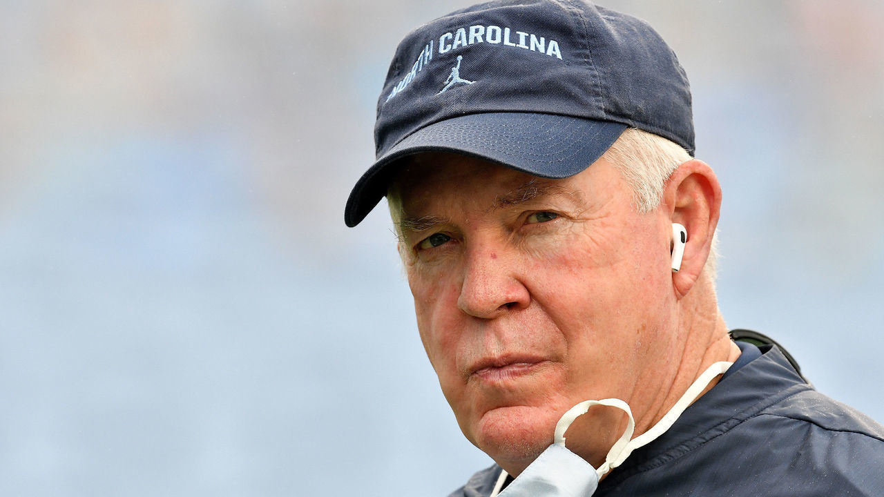 CHAPEL HILL, NORTH CAROLINA - SEPTEMBER 12: head coach Mack Brown of the North Carolina Tar Heels removes is mask for a television interview before their game against the Syracuse Orange at Kenan Stadium on September 12, 2020 in Chapel Hill, North Carolina.