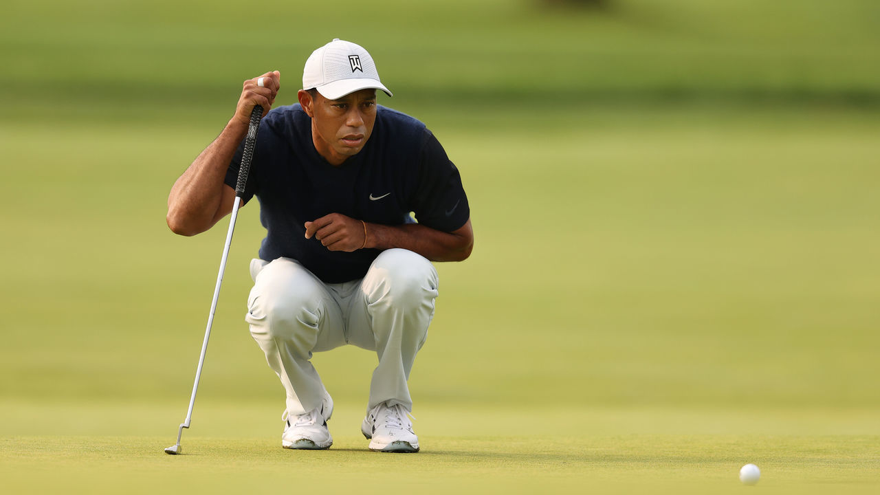MAMARONECK, NEW YORK - SEPTEMBER 17: Tiger Woods of the United States lines up his putt on the first green during the first round of the 120th U.S. Open Championship on September 17, 2020 at Winged Foot Golf Club in Mamaroneck, New York.