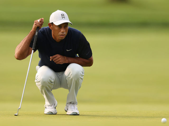 MAMARONECK, NEW YORK - SEPTEMBER 17: Tiger Woods of the United States lines up his putt on the first green during the first round of the 120th U.S. Open Championship on September 17, 2020 at Winged Foot Golf Club in Mamaroneck, New York.