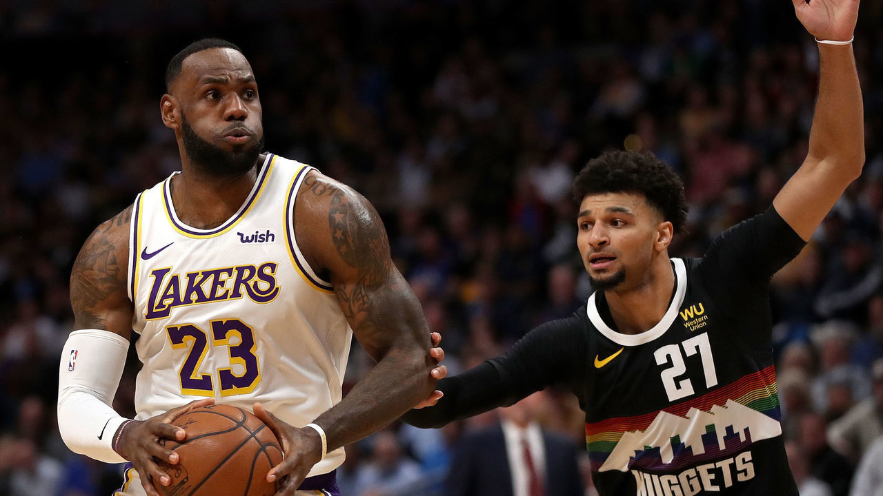 DENVER, COLORADO - DECEMBER 03: Lebron James #23 of the Los Angeles Lakers drives against Jamal Murray #27 of the Denver Nuggets in the first quarter at Pepsi Center on December 03, 2019 in Denver, Colorado.