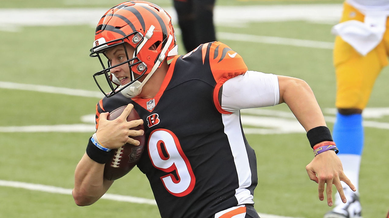 CINCINNATI, OHIO - SEPTEMBER 13: Quarterback Joe Burrow #9 of the Cincinnati Bengals rushes with the ball before scoring his first career NFL touchdown against the Los Angeles Chargers during the first quarter at Paul Brown Stadium on September 13, 2020 in Cincinnati, Ohio.