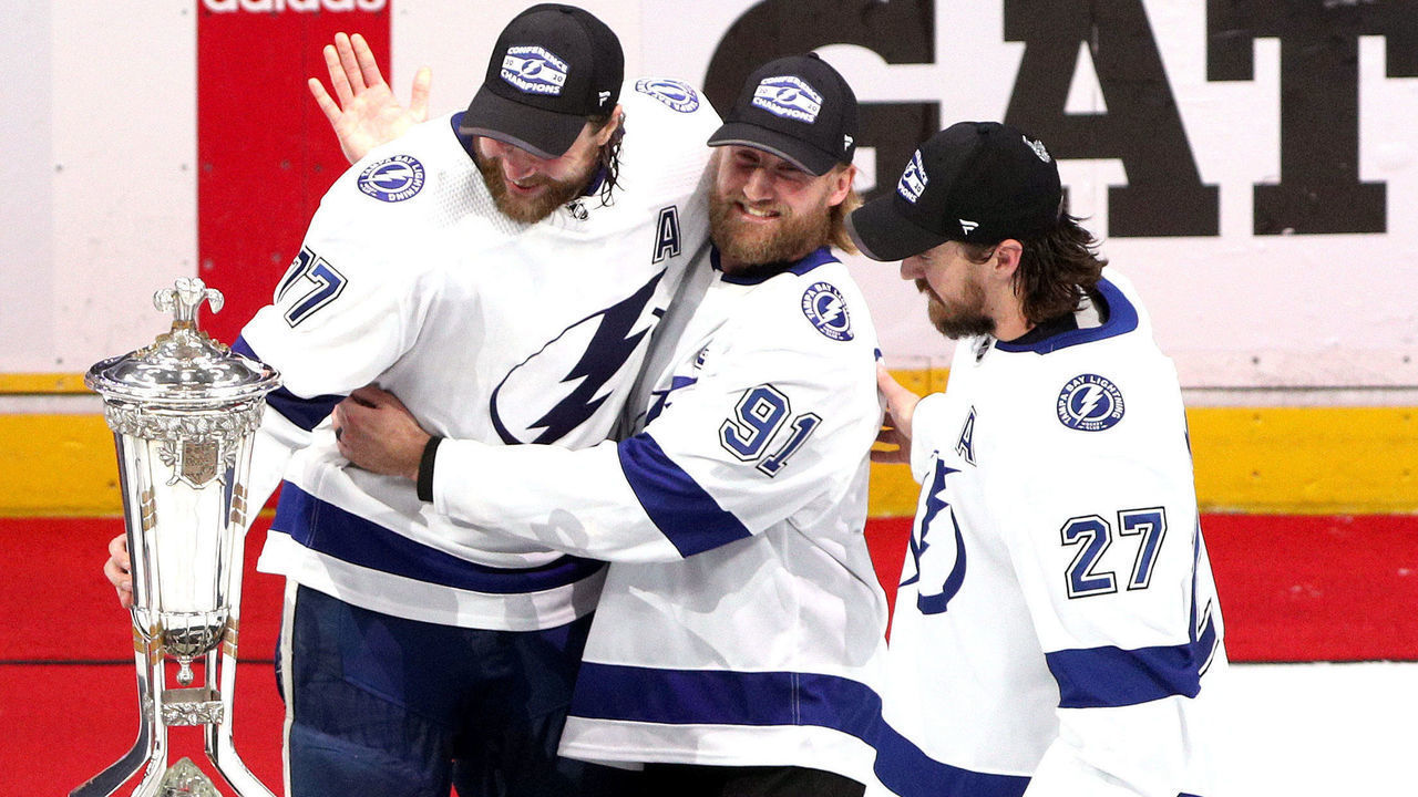 EDMONTON, ALBERTA - SEPTEMBER 17: Victor Hedman #77, Steven Stamkos #91 and Ryan McDonagh #27 of the Tampa Bay Lightning pose with the Prince of Wales Trophy after their 2-1 win in the first overtime period of Game Six of the Eastern Conference Final of the 2020 NHL Stanley Cup Playoffs between the Tampa Bay Lightning and the New York Islanders at Rogers Place on September 17, 2020 in Edmonton, Alberta. The Lightning defeated the Islanders 2-1 in overtime of game six to take the best of seven game series 4-2.