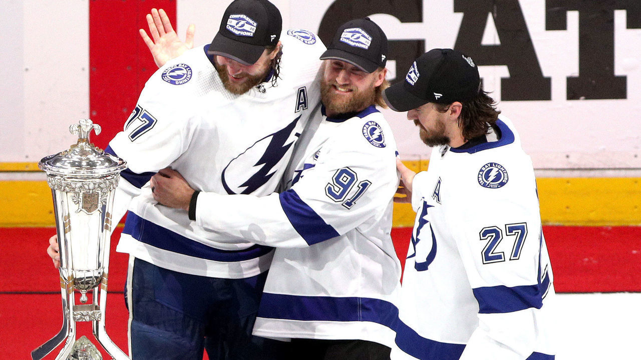EDMONTON, ALBERTA - SEPTEMBER 17: Victor Hedman #77, Steven Stamkos #91 and Ryan McDonagh #27 of the Tampa Bay Lightning pose with the Prince of Wales Trophy after their 2-1 win in the first overtime period of Game Six of the Eastern Conference Final of the 2020 NHL Stanley Cup Playoffs between the Tampa Bay Lightning and the New York Islanders at Rogers Place on September 17, 2020 in Edmonton, Alberta. The Lightning defeated the Islanders 2-1 in overtime of game six to take the best of seven game series 4-2.