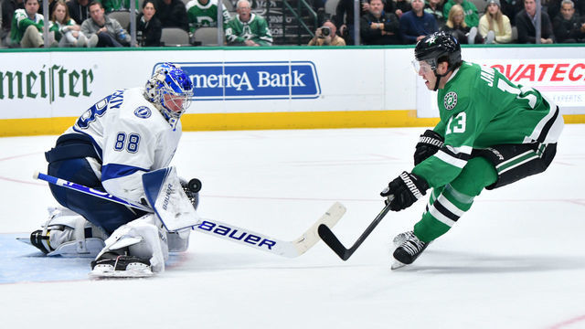 DALLAS, TX - JANUARY 27: Andrei Vasilevskiy #88 of the Tampa Bay Lightning stops a shot against Mattias Janmark #13 of the Dallas Stars at the American Airlines Center on January 27, 2020 in Dallas, Texas.
